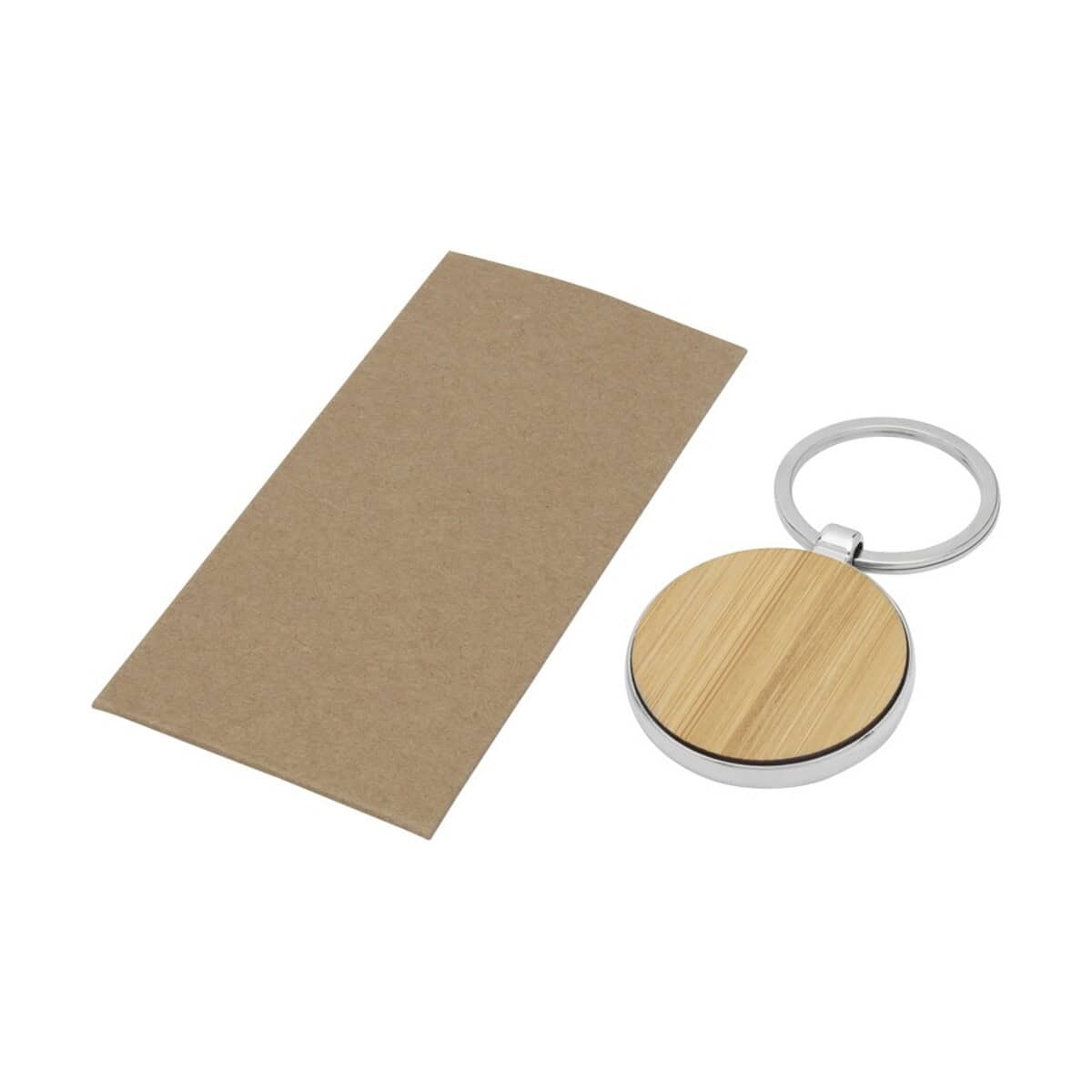 Breloki wielofunkcyjne z logo – okrągły brelok do kluczy nino z bambusa 11812571_e1 Gadżet z grawerem - metalowy brelok z drewnianym elementem na prezent reklamowy.